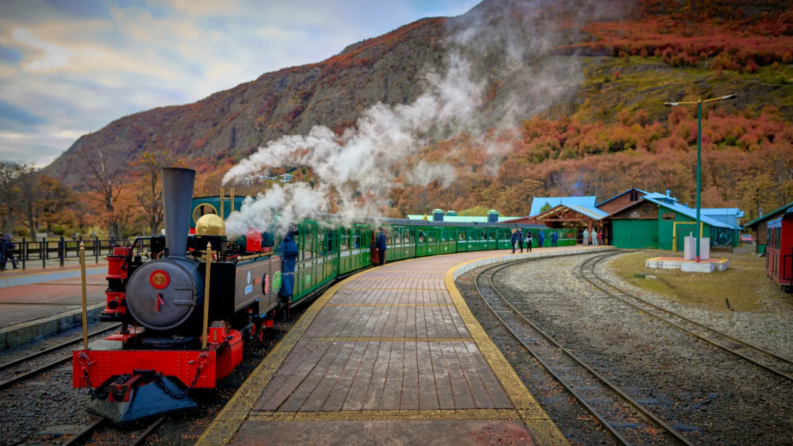 Steam locomotive waiting at the End of the World Station platform in autumn