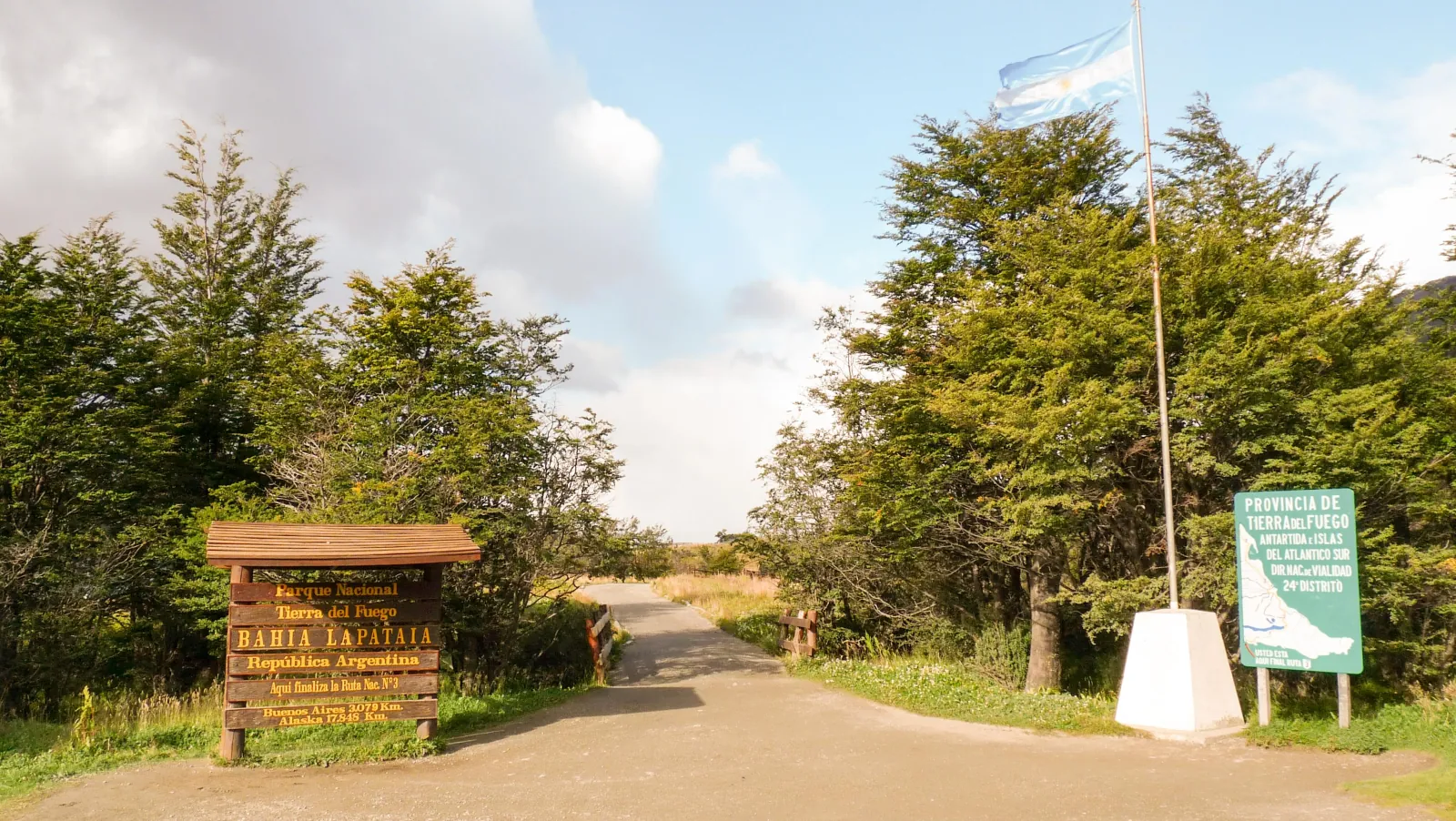 Entrance sign and flag at the gate of Tierra del Fuego National Park