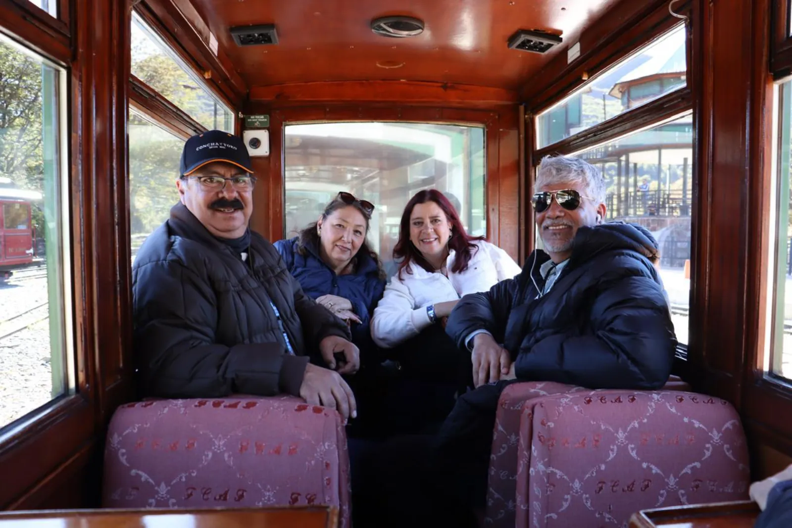 Passengers seated inside a train carriage
