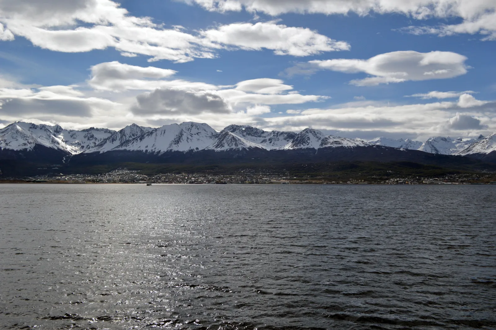 Snow-capped mountains above the Beagle Channel seen from the water